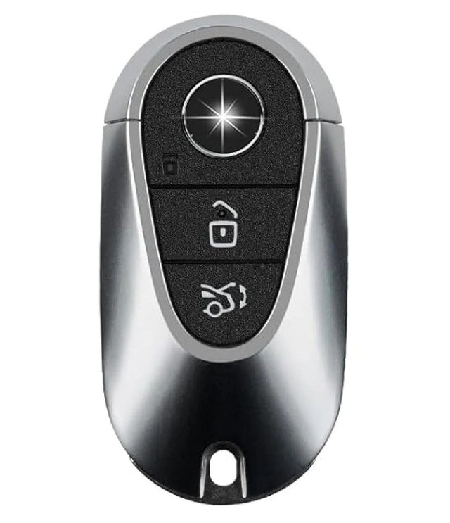 Mercedes-Benz M3 oval smart key with a silver frame, three black button areas and a round emblem near the top