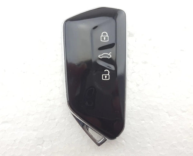 Skoda Octavia-style glossy black smart key with three vertically arranged lock, boot and unlock symbols